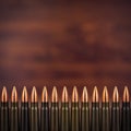 Many bullets closeup on a wooden background