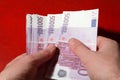 Many bundle of 500 Euro bank notes in man's hands Royalty Free Stock Photo