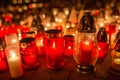 Many burning candles in the cemetery at night on the occasion souls of the deceased