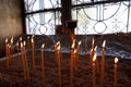 Many burning wax candles in the Saint George`s chapel, Mount Lycabettus, Athens, Greece. Royalty Free Stock Photo