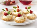 Many cakes, cupcakes with fresh fruits (strawberries), whipped cream, jelly and mints Royalty Free Stock Photo