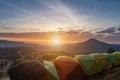 Many camping tent on green field near forest during dramatic sunrise at summer misty morning,Concept of outdoor camping adventure