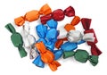 Many candies in colorful wrappers on white background, top view Royalty Free Stock Photo
