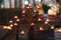 Many candles in the dark Catholic church Royalty Free Stock Photo
