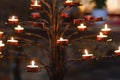 Many candles in the dark Catholic church Royalty Free Stock Photo