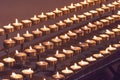 Many candles fire lit in the church Royalty Free Stock Photo