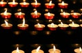 many candles lit inside the place of worship to pray Royalty Free Stock Photo