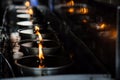 Many  candles in oil plate light up for people to offering or pray to buddha in Thai`s temple Royalty Free Stock Photo