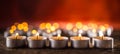 Many candles symolizing funeral religios christmas spa celebration birthday spirituality peace memorial or holiday burning