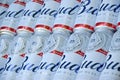 Many Cans of Budweiser Lager Alcohol Beer lies on camo surface. Budweiser is Brand from Anheuser-Busch Inbev most popular in