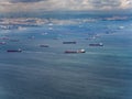 Many cargo ships waiting on the sea