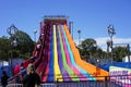 Climbing to the top of the Rainbow slide Royalty Free Stock Photo