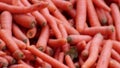 Many carrots on organic carrots heap as organic animal feedstuff and healthy fodder for cows and cattle for vegetarian nutrition w