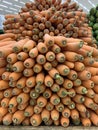 Many carrots in the supermarket in bulk.