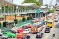 Many cars, bus and motorcycles cause traffic jams at Rajdamri Road. People walking on Sky Walk Central world - Platinum mall