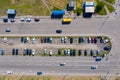 Many cars are parked in a spontaneous intercepting parking lot between two avenues on the outskirts of the city. Aerial photograph Royalty Free Stock Photo