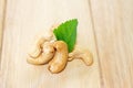 many cashew nut on wooden table with green leaf use for cooking Royalty Free Stock Photo