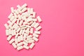 Many chewing gum pieces on pink background, flat lay. Space for text Royalty Free Stock Photo