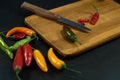 Many chili peppers on wood cutting board Royalty Free Stock Photo