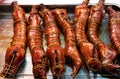 Many Chinese bacon and sausage arranged together for sale in the market. Chinese smoked pork meat.