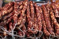 Many Chinese bacon and sausage arranged together for sale in the market. Chinese smoked pork meat.