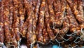 Many Chinese bacon and sausage arranged together for sale in the market. Chinese smoked pork meat.