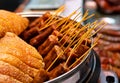 Many Chinese bacon and sausage arranged together for sale in the market. Chinese smoked pork meat.