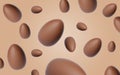 Many chocolate eggs falling on dark beige background