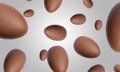 Many chocolate eggs falling on light grey background