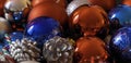 Many christmas balls and pinecones. Close up. Selective focus. Christmas decoration Royalty Free Stock Photo