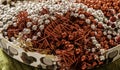 Many christmas garlands piled up in a basket. Close up. Selective focus. Christmas decoration