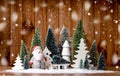 Many christmas trees with lights and santa claus