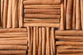 Many cinnamon sticks as background