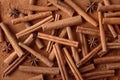 Many cinnamon sticks on powder