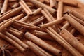 Many cinnamon sticks and powder, closeup