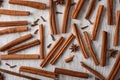Many cinnamon sticks on wooden background, top view