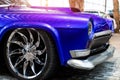 Many classic purple vintage old american cars parked in row at garage, exhibition of fest. Close-up detail view Royalty Free Stock Photo