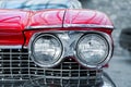 Many classic red vintage old american cars parked in row at garage, exhibition of fest. Close-up detail view beautiful Royalty Free Stock Photo