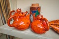 many clay jugs pressed on the shelf for drying. The concept of tableware and a useful hobby