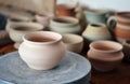 Many clay pot is on the table
