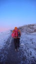 Many climbers and mountain guides arrive on the summit of Mount Kilimanjaro just after sunrise Royalty Free Stock Photo