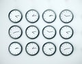 Many clock on white wall Royalty Free Stock Photo