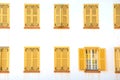 Many closed windows with shutters