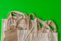 Many cloth bags on the green scene Royalty Free Stock Photo