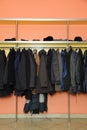 Many clothes in cloakroom Royalty Free Stock Photo