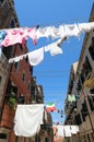 clothes hanging out to dry in a narrow Venice alley on a hot sum Royalty Free Stock Photo