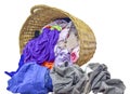 Many clothes with in wicker basket on isolated white background Royalty Free Stock Photo