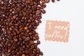 Many coffee beans on white background and message.