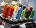 Many coils with colored thread. Clothing industry