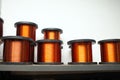 Many coils of copper wire in the production workshop, winding copper cable on spools